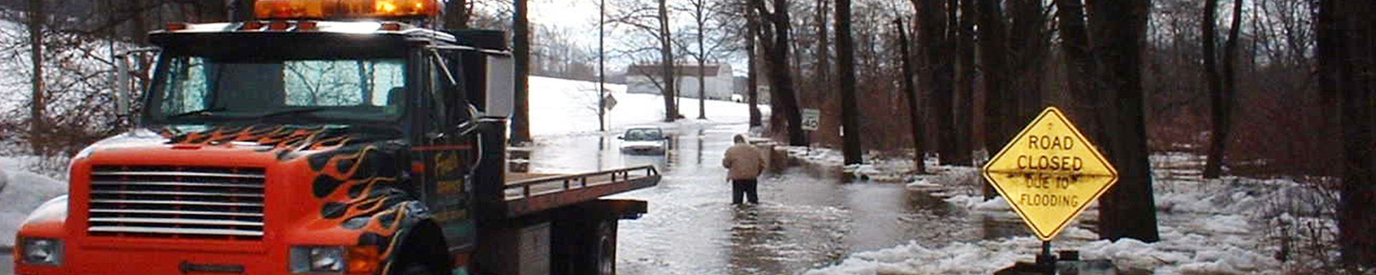 closed flooded road in winter